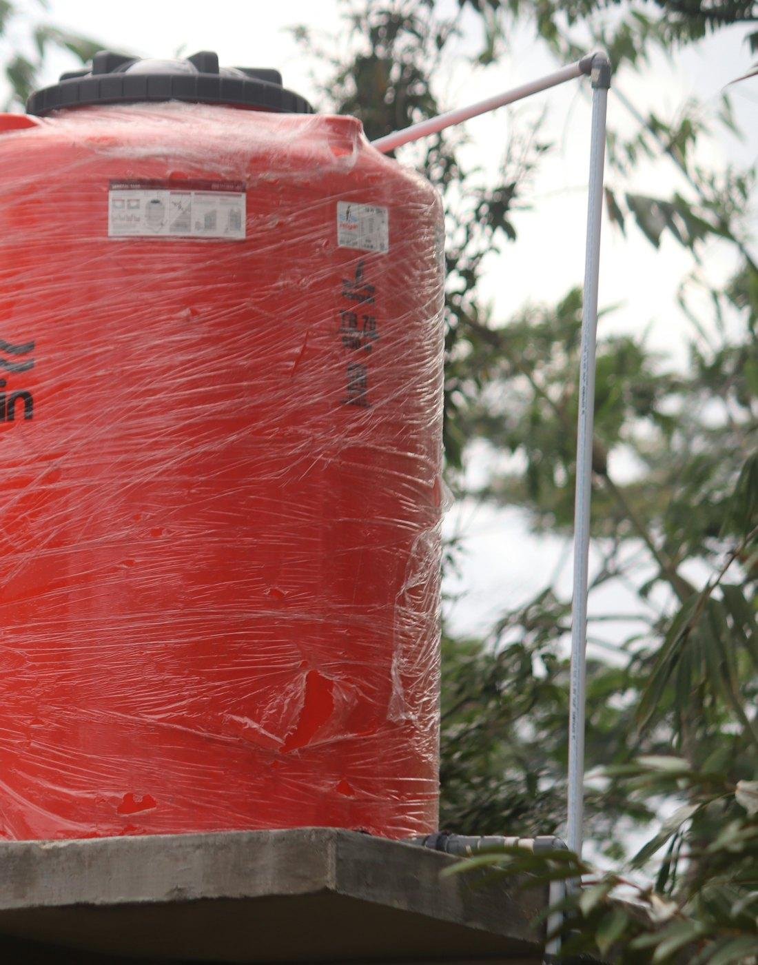 Red rotomoulded plastic water tank